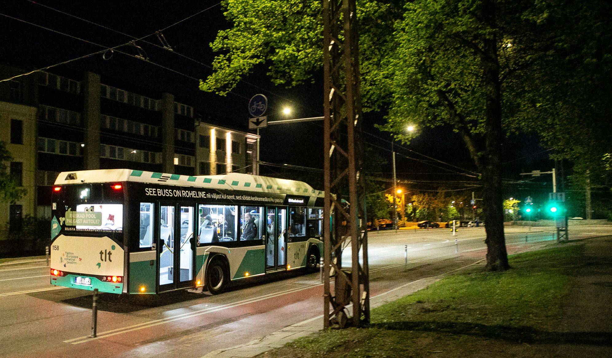 Night bus driving on the streets of Tallinn, Estonia.