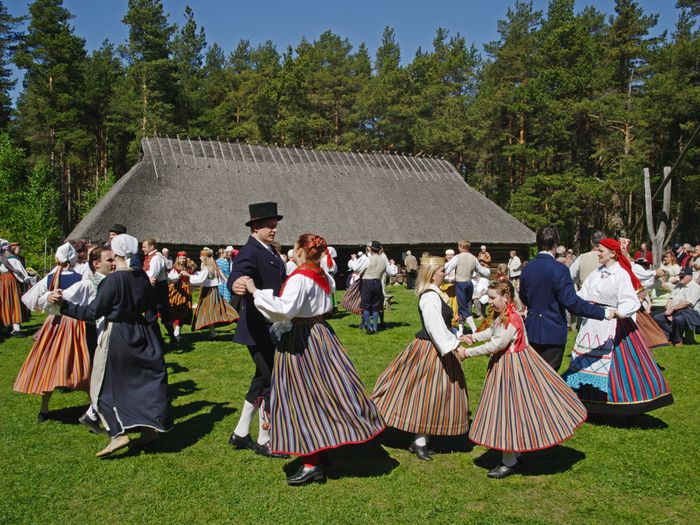 Folk dancers performing in front of an old tavern in the Open Air museum in the Rocca al Mare area Tallinn, Estonia. Photo by: Toomas Tuul