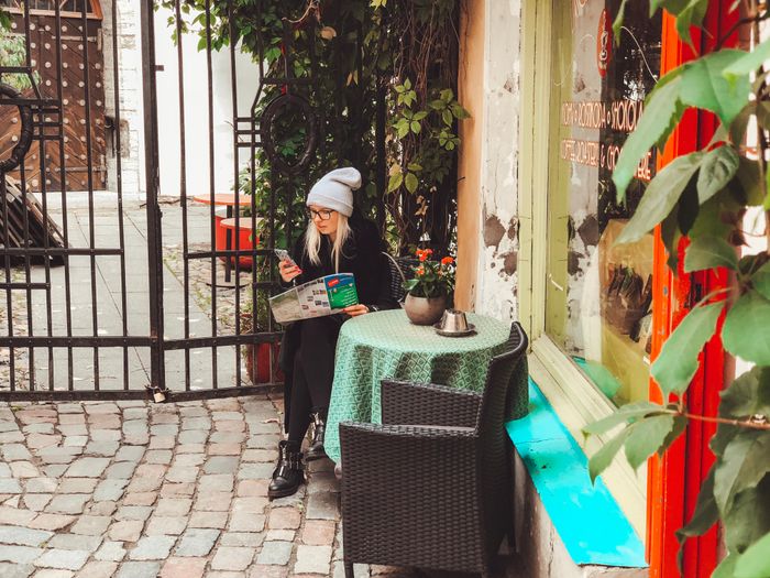 Woman at  the Old Town of Tallinn, Estonia, looking at a map of the city.  Photo: Kadi-Liis Koppel