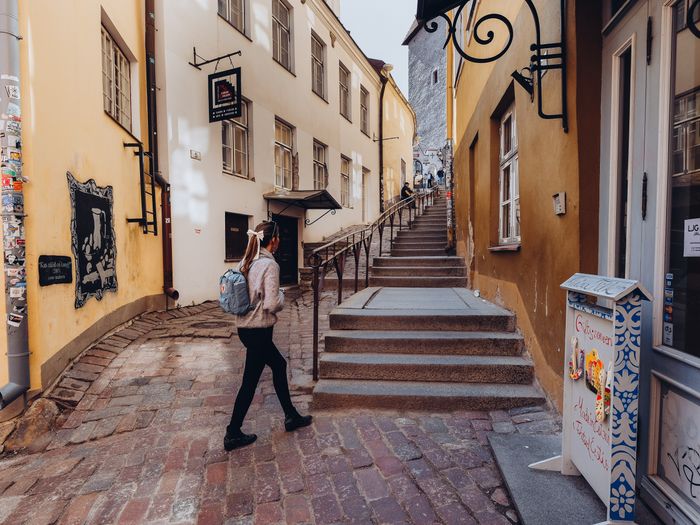 A woman on a romantic street in the medieval Old Town of Tallinn, Estonia Photo: Kadi-Liis Koppel