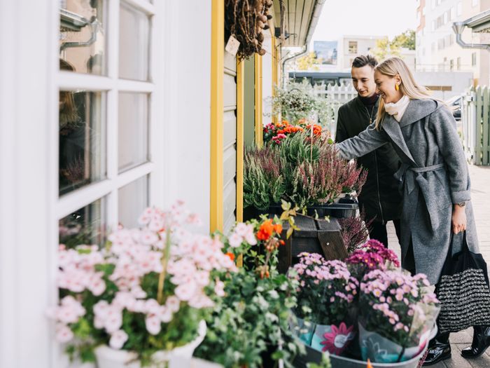 Couple looking at wares at Nõmme Market in Tallinn, Estonia