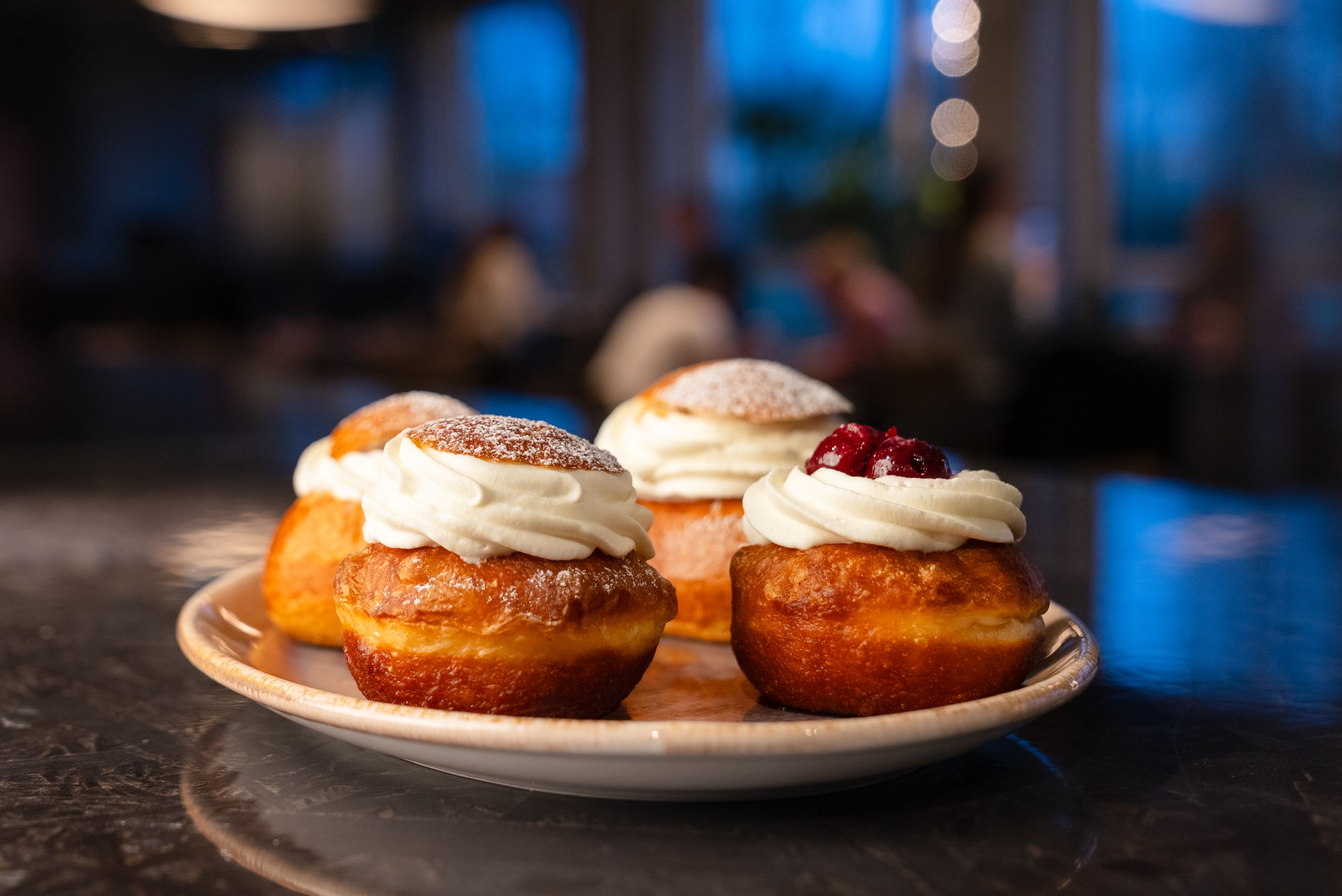 Cream buns from Sumi café Plate of cream buns with whipped cream and jam from Sumi café, prepared for Bun Fest.